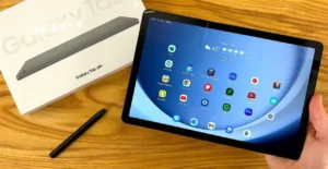 Samsung Galaxy Tab A9 budget tablet with stylus on wooden desk showing Android home screen and app icons-Best Budget Tablet 2026