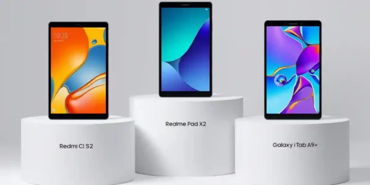 Three budget tablets displayed on white podiums showing Redmi Pad SE 2, Realme Pad X2, and Samsung Galaxy Tab A9+ side by side comparison-Best Budget Tablet 2026