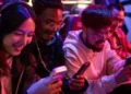 A group of people using smartphones-Best Budget Powerhouses Smartphones You Can Buy in 2026